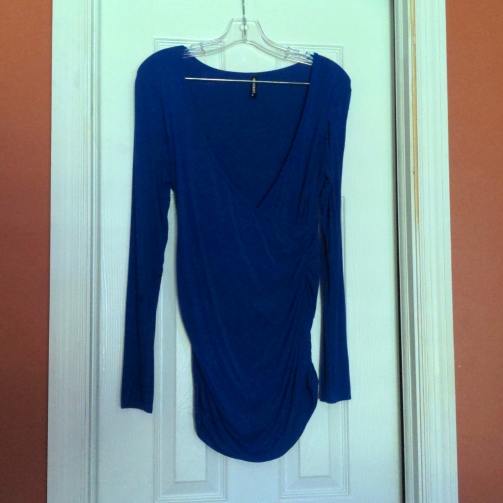 Top. Lightweight and comfy. Long sleeves low cut in front.